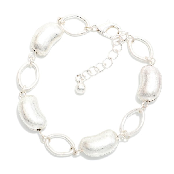 Chain Link Bracelet Featuring Metal Tone Bead Stations 

- Approximately 2.5" D
- Extender 2" L