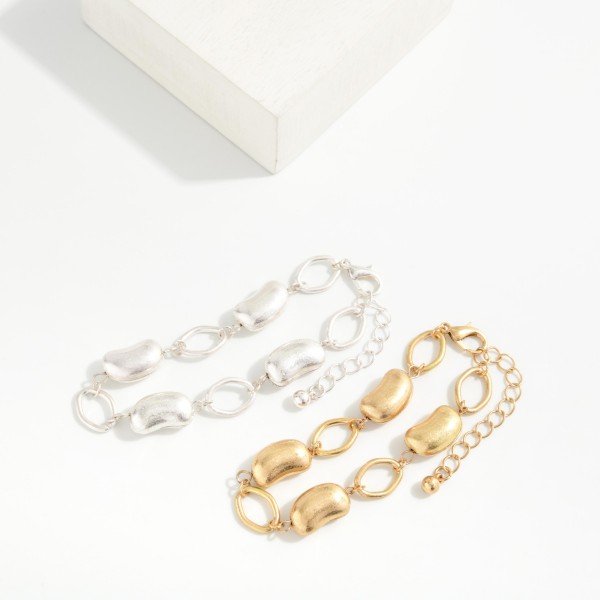 Chain Link Bracelet Featuring Metal Tone Bead Stations 

- Approximately 2.5" D
- Extender 2" L