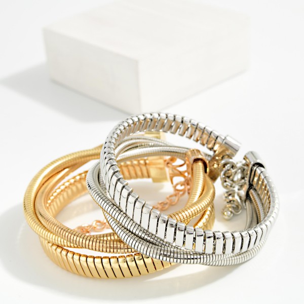 Layered Metal Tone Coiled Bracelet 

- Approximately 2.5" D