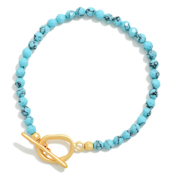 Faceted Stone Beaded Stretch Bracelet With Metal Tone Toggle Clasp 

- Approximately 2.25" D