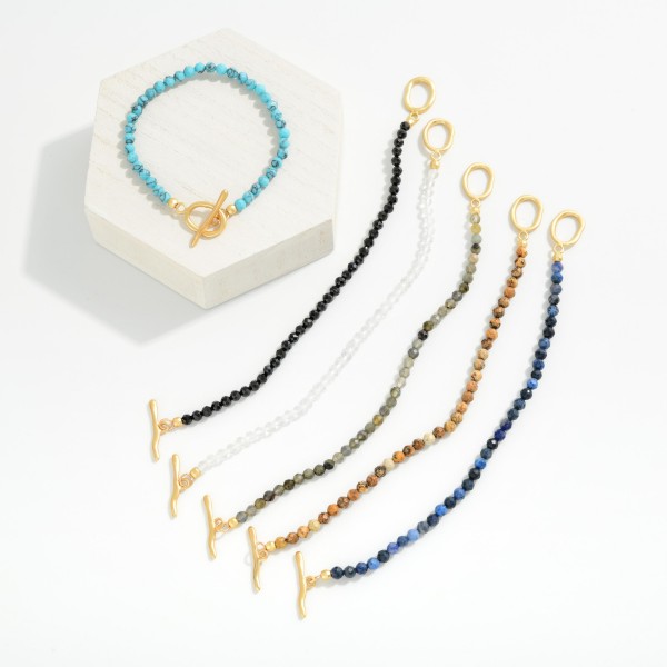 Faceted Stone Beaded Stretch Bracelet With Metal Tone Toggle Clasp 

- Approximately 2.25" D