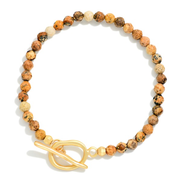 Faceted Stone Beaded Stretch Bracelet With Metal Tone Toggle Clasp 

- Approximately 2.25" D