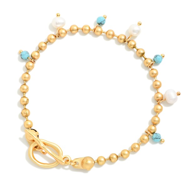Metal Tone Ball Chain Bracelet Featuring Stone & Pearl Charms With Toggle Clasp 

- Approximately 3" D