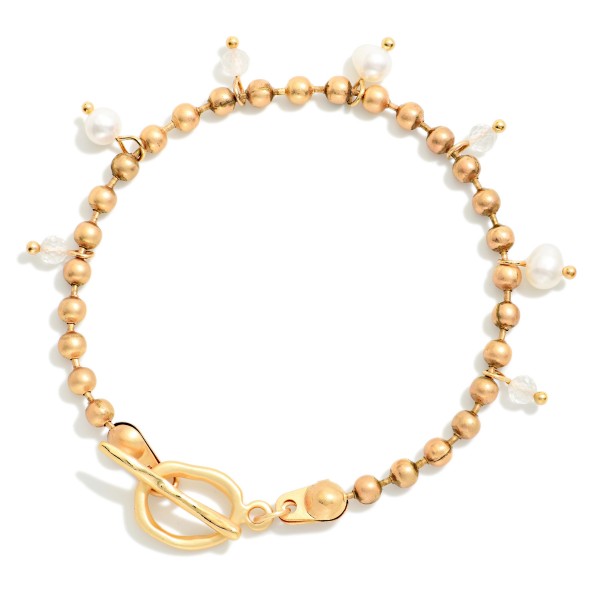 Metal Tone Ball Chain Bracelet Featuring Stone & Pearl Charms With Toggle Clasp 

- Approximately 3" D