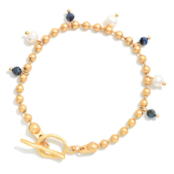 Metal Tone Ball Chain Bracelet Featuring Stone & Pearl Charms With Toggle Clasp 

- Approximately 3" D