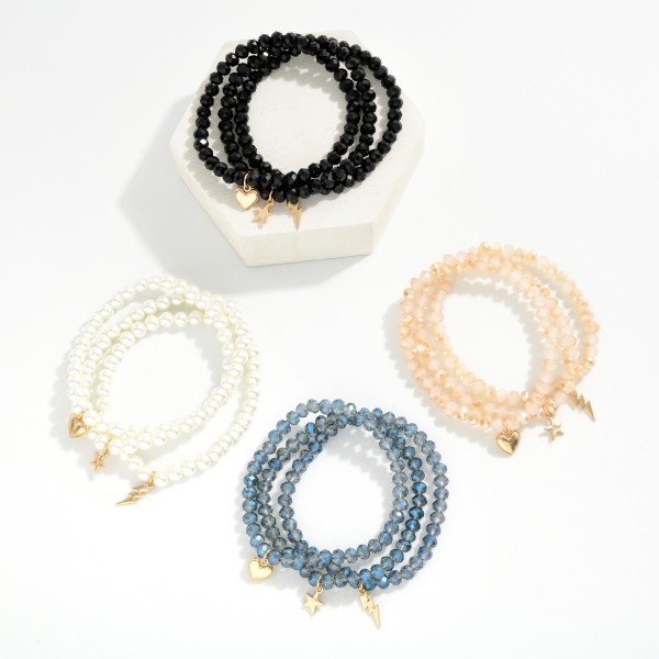 Set OF Three Beaded Stretch Bracelets Featuring Metal Tone Heart, Star, & Lightning Bolt Charms 

- Approximately 3" D