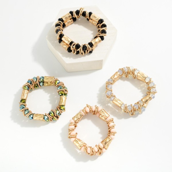 Layered Beaded Stretch Bracelet Featuring Faceted Beads, Metal Tone Hoops, & Hammered Metal Cylinder Beads 

- Approximately 2" D