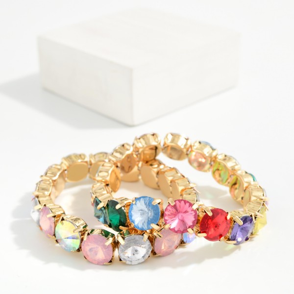 Oval Crystal Stretch Bracelet set with large faceted glass stones in polished cup settings for a bold, jewel box look. The stretch fit slips on easily and stacks well with bangles and watches. Perfect for holiday parties, weddings, and adding sparkle to everyday outfits. Glamorous crystal bracelets are proven impulse sellers and pair with matching crystal necklaces for easy set sales.
