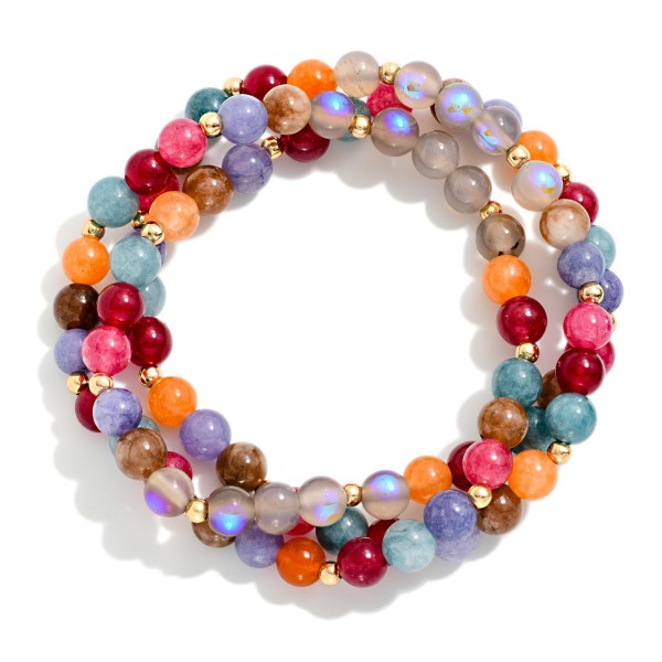 Beaded Stretch Bracelet Set of three stackable strands with polished round stone look beads, iridescent moonstone style accents and tiny metal spacers. Wear all three for a stacked look or split them up to mix with watches and bangles. A cheerful everyday set for weekends, travel and gifting. Bracelet sets feel like extra value to shoppers and make an easy gift.