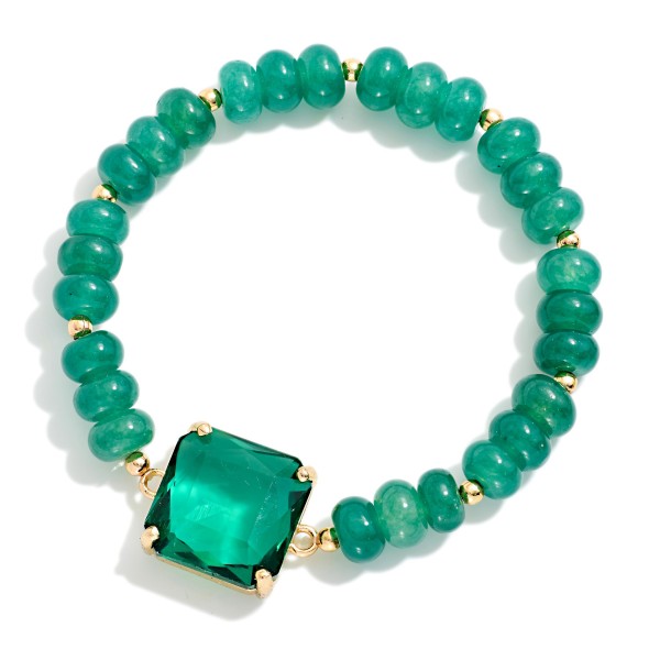 Beaded Crystal Stretch Bracelet strung with faceted rondelle beads in a blended mix and centered with a square cut crystal in a prong setting. The stretch fit slips right on and stacks easily with other bracelets. Pair it with the matching beaded pendant necklace for an easy gift set. A sparkly, giftable piece that sells well when several colorways are displayed together.