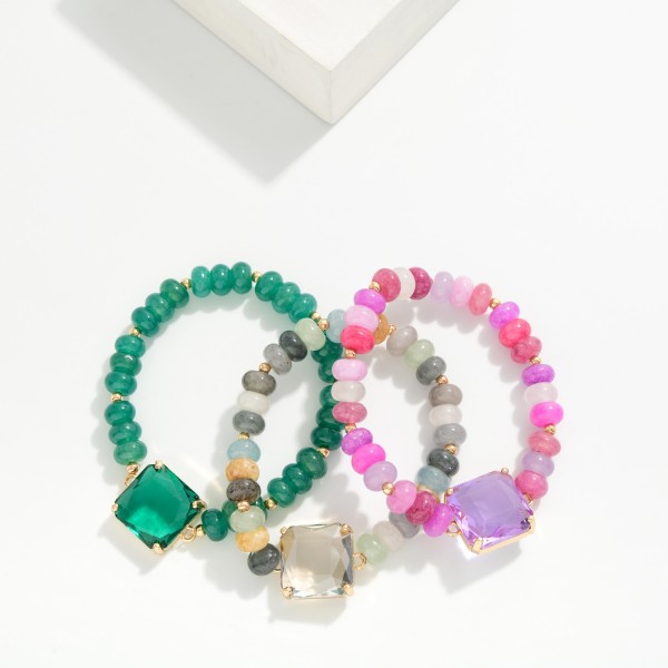 Beaded Crystal Stretch Bracelet strung with faceted rondelle beads in a blended mix and centered with a square cut crystal in a prong setting. The stretch fit slips right on and stacks easily with other bracelets. Pair it with the matching beaded pendant necklace for an easy gift set. A sparkly, giftable piece that sells well when several colorways are displayed together.