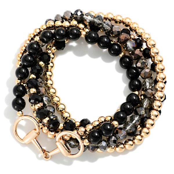 Beaded Stretch Bracelet Set with several stackable strands mixing polished metal ball beads, faceted crystal beads and glossy round beads, finished with a horsebit link accent. Wear them all together for an instant arm party or split them up to mix with watches and bangles. A versatile set for the office, holiday parties and weekend outfits. Bracelet sets feel like extra value to shoppers and sell quickly as gifts.