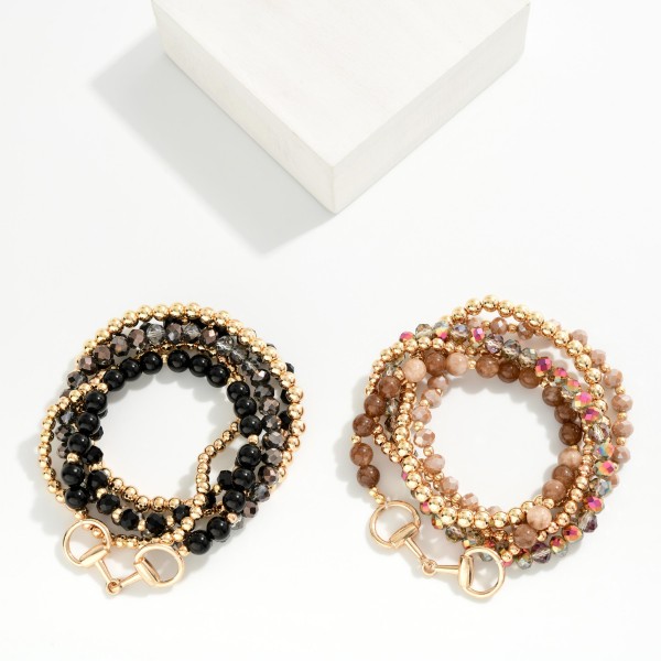 Beaded Stretch Bracelet Set with several stackable strands mixing polished metal ball beads, faceted crystal beads and glossy round beads, finished with a horsebit link accent. Wear them all together for an instant arm party or split them up to mix with watches and bangles. A versatile set for the office, holiday parties and weekend outfits. Bracelet sets feel like extra value to shoppers and sell quickly as gifts.