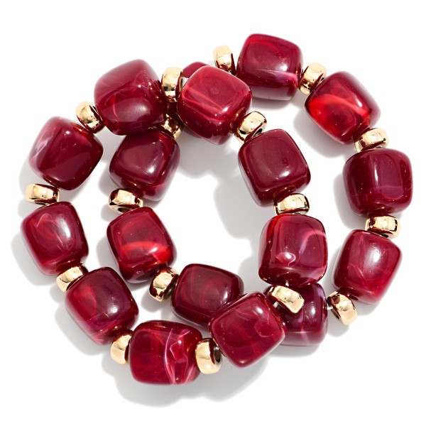 Chunky Marbled Resin Bead Stretch Bracelet featuring oversized cube beads with a swirled, glossy finish separated by polished metal rondelles. The bold beads make a statement on their own or stack easily with bangles and watches. Comfortable stretch fit slides on with no clasp. A trend forward, affordable style that coordinates with fall and holiday wardrobes and sells quickly when displayed in multiples.