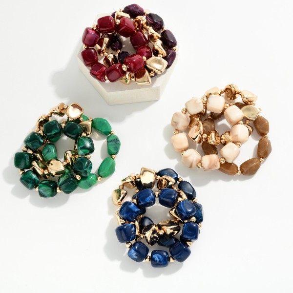 Chunky Nugget Stretch Bracelet Set mixing glossy marbled resin stones with polished metal nuggets for a bold, collected stack. Wear the strands together for maximum impact or split them up to layer with watches and bangles. Elastic stretch construction slips on easily and fits most wrists. Ready made stacks give shoppers a complete look in one grab, which makes this set a quick turning favorite for boutique bracelet displays.