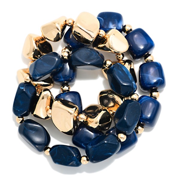 Chunky Nugget Stretch Bracelet Set mixing glossy marbled resin stones with polished metal nuggets for a bold, collected stack. Wear the strands together for maximum impact or split them up to layer with watches and bangles. Elastic stretch construction slips on easily and fits most wrists. Ready made stacks give shoppers a complete look in one grab, which makes this set a quick turning favorite for boutique bracelet displays.