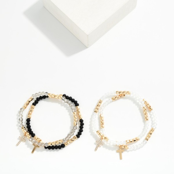 Cross Charm Beaded Stretch Bracelet Set featuring faceted glass beads, faux pearls, and polished metal tube accents finished with a dangling cross charm. The coordinated strands create an instant stacked look that customers can wear together or apart. Easy stretch fit with no clasp. A meaningful, giftable set for Easter, baptisms, and everyday faith styling.