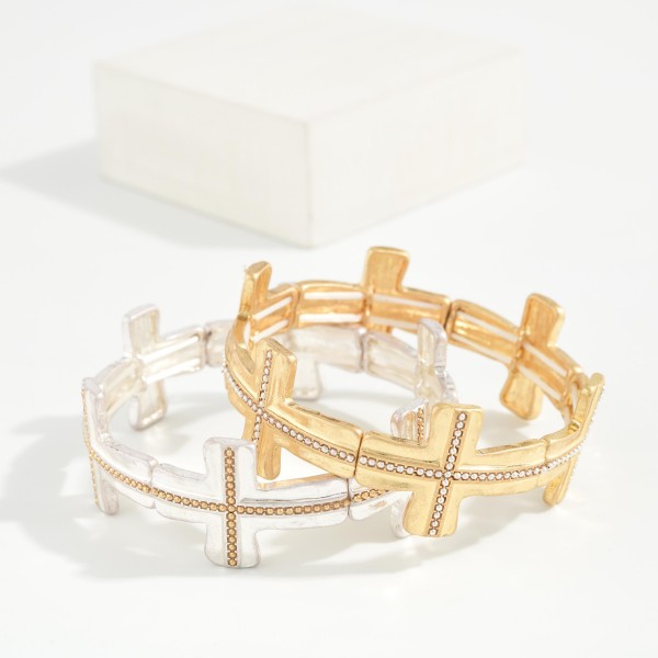Mixed Metal Cross Stretch Bracelet featuring a series of cross links with a beaded inlay in a contrasting metal tone, strung on a comfortable stretch fit. Slides on easily with no clasp and sits flat on the wrist. A meaningful faith style that coordinates with the matching textured cross necklaces. Ideal for gifting at Easter, baptisms, and Christmas, and an easy everyday seller.