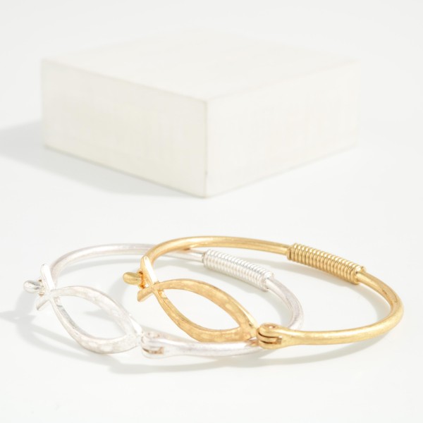Faith Fish Wire Bangle Bracelet featuring an open Christian fish symbol at the center of a slim wire band with a coiled wrap detail. The hook closure makes it easy to put on and take off. A subtle, meaningful piece for everyday wear that stacks well with other bangles. A thoughtful gift for church groups, baptisms, and Easter, and an affordable faith style for your display.