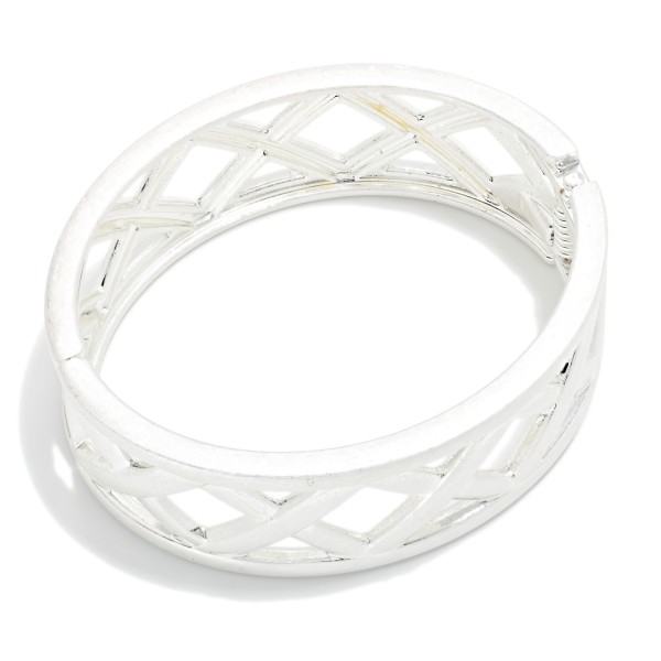 Lattice Cutout Hinged Bangle Bracelet featuring a wide band with an open crisscross pattern framed by smooth polished edges. The hinged design opens for easy on and off and closes securely. Bold and architectural, it works as a standalone statement or stacked with slimmer bangles. A versatile piece that dresses up casual outfits and makes an easy gift.