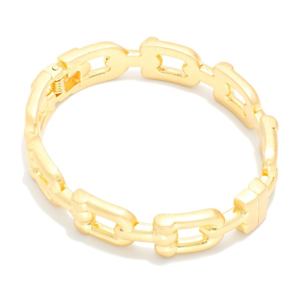 Open Link Stretch Bracelet featuring rectangular chain style links in a brushed metal finish on a comfortable stretch fit. The cutout pattern keeps it light while still giving a bold chain link look. Slides on easily with no clasp to fuss with. An easy stacking piece that pairs with bangles and watches and sells well across all ages.