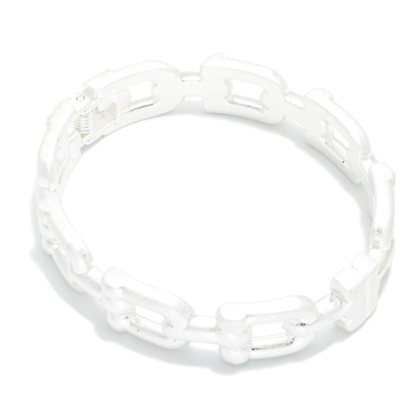 Open Link Stretch Bracelet featuring rectangular chain style links in a brushed metal finish on a comfortable stretch fit. The cutout pattern keeps it light while still giving a bold chain link look. Slides on easily with no clasp to fuss with. An easy stacking piece that pairs with bangles and watches and sells well across all ages.