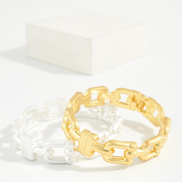 Open Link Stretch Bracelet featuring rectangular chain style links in a brushed metal finish on a comfortable stretch fit. The cutout pattern keeps it light while still giving a bold chain link look. Slides on easily with no clasp to fuss with. An easy stacking piece that pairs with bangles and watches and sells well across all ages.