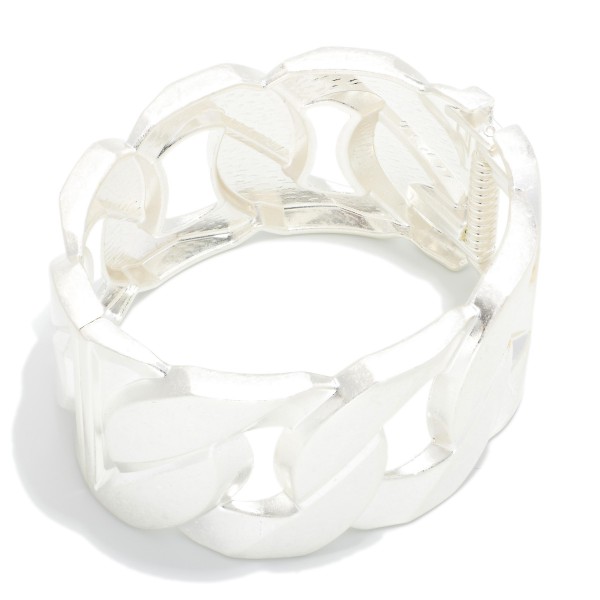 Chunky Curb Link Stretch Bracelet featuring wide, flat links in a soft brushed finish strung on a comfortable stretch fit. The oversized chain design makes a bold statement while sliding on easily with no clasp. Perfect for stacking or wearing alone with sweaters and casual looks. Chunky metal bracelets are a strong seller, and this style delivers the look at an approachable price.