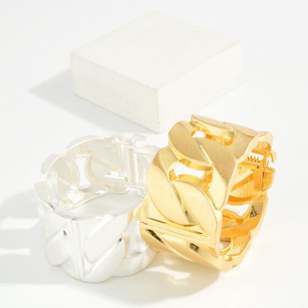 Chunky Curb Link Stretch Bracelet featuring wide, flat links in a soft brushed finish strung on a comfortable stretch fit. The oversized chain design makes a bold statement while sliding on easily with no clasp. Perfect for stacking or wearing alone with sweaters and casual looks. Chunky metal bracelets are a strong seller, and this style delivers the look at an approachable price.