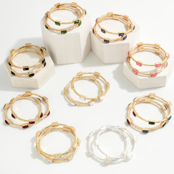 Framed Stone Station Bangle Bracelet with polished square stones set along slim wire bands for an easy stacked look. The clean framed settings give it a refined, vintage inspired finish that dresses up everyday outfits. Slips on easily and pairs well with watches and stretch styles. Offered in a wide range of stone options, it's perfect for building a coordinated bangle display and encouraging multiple purchases.