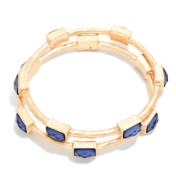 Framed Stone Station Bangle Bracelet with polished square stones set along slim wire bands for an easy stacked look. The clean framed settings give it a refined, vintage inspired finish that dresses up everyday outfits. Slips on easily and pairs well with watches and stretch styles. Offered in a wide range of stone options, it's perfect for building a coordinated bangle display and encouraging multiple purchases.