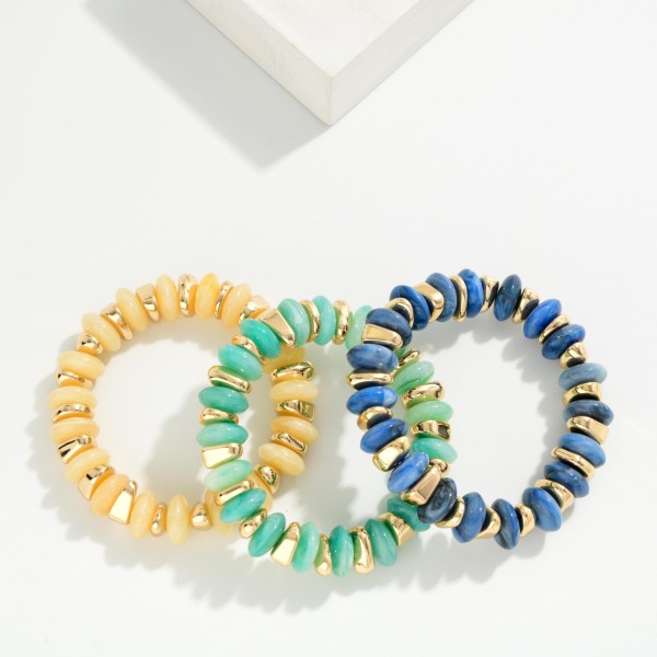 Beaded Stretch Bracelet stacked with chunky rondelle beads and polished metal spacer discs for a bold, textured look. The marbled stone effect beads add depth while the metal accents bring just enough shine. Elastic stretch construction slips on easily and fits most wrists. Wear it solo or stack it with watches and bangles. Beaded stackers are a boutique bestseller, and this style is an easy grab for customers building a bracelet stack.