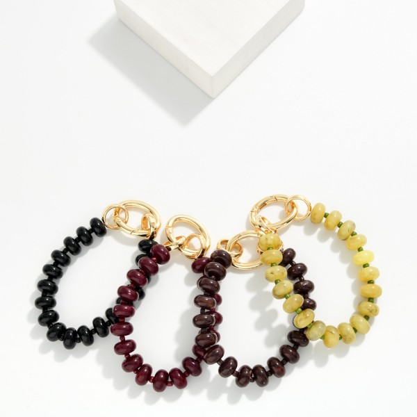 Rondelle Bead Bracelet with an oversized statement clasp, strung with smooth, glossy beads for a polished modern look. The chunky lock style closure is both functional and decorative, adding a trendy hardware detail that stands out in any stack. Easy to fasten on your own and comfortable for everyday wear. Hardware inspired jewelry is trending, and this bracelet gives shoppers that look at a friendly price.
