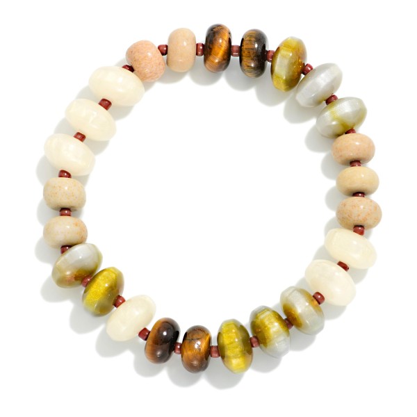 Faceted Crystal Rondelle Stretch Bracelet strung with glass beads in a mixed, iridescent finish that shimmers with every movement. The stretch fit slips on easily and stacks beautifully with bangles, watches, and other beaded pieces. A polished everyday accessory for work, weekends, and holiday events. Pairs with the matching crystal rondelle necklace for an easy set sale and makes a reliable gift item.