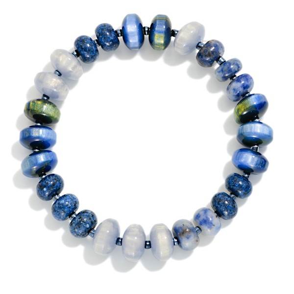Faceted Crystal Rondelle Stretch Bracelet strung with glass beads in a mixed, iridescent finish that shimmers with every movement. The stretch fit slips on easily and stacks beautifully with bangles, watches, and other beaded pieces. A polished everyday accessory for work, weekends, and holiday events. Pairs with the matching crystal rondelle necklace for an easy set sale and makes a reliable gift item.