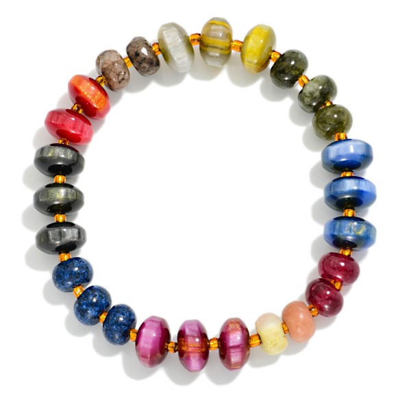 Faceted Crystal Rondelle Stretch Bracelet strung with glass beads in a mixed, iridescent finish that shimmers with every movement. The stretch fit slips on easily and stacks beautifully with bangles, watches, and other beaded pieces. A polished everyday accessory for work, weekends, and holiday events. Pairs with the matching crystal rondelle necklace for an easy set sale and makes a reliable gift item.