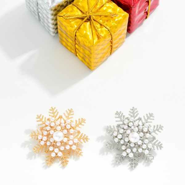 Metal Christmas Snowflake Brooch Pin Featuring Pearls 
- Approximately 1.75" D 
- Gold Dipped