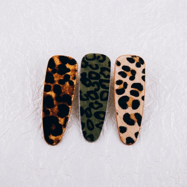 Faux fur leopard print hair clip. Approximately 3" in length.
