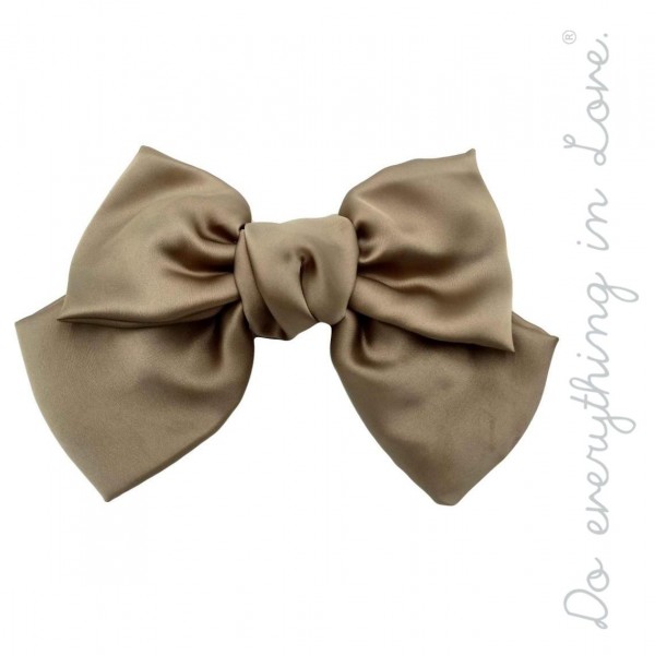 Do everything in Love brand solid silky oversized hair bow barrette.

- One size
- Approximately 6" W x 5" L
- 100% Polyester