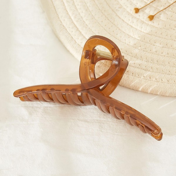 Translucent Criss Cross Hair Claw.

- Approximately 5" L