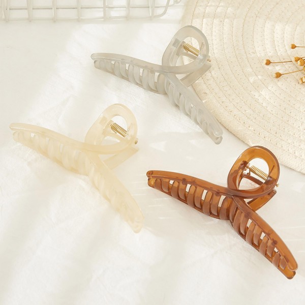 Translucent Criss Cross Hair Claw.

- Approximately 5" L