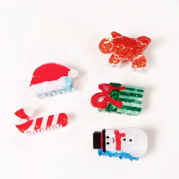 Holiday-shaped claw hair clip molded in glossy acrylic with hand-painted seasonal detail and a glitter-flecked finish. Strong-grip teeth hold a twist, a half-up, or a full clip-up on fine and thick hair alike, so it works for everyday wear and not just the party. A natural stocking stuffer, teacher gift, and secret-santa filler that buyers grab in multiples. Small footprint and low price point make it an easy counter or holiday-display add.