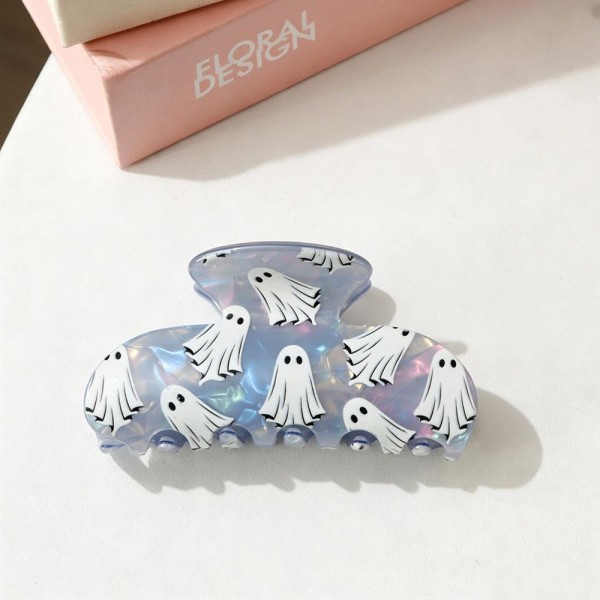 Ghost Claw Hair Clip covered in cute cartoon ghosts on a glossy, shimmery acrylic body. The rounded shape and sturdy spring hinge hold medium to thick hair in a quick twist or half up style that lasts all day. Perfect for Halloween parties, fall festivals, trunk or treat, and spooky season outfits, and a sweet add to treat bags. A seasonal favorite that sells fast through October, these playful clips make an easy register display impulse buy.