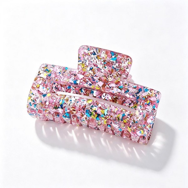 Confetti Glitter Claw Hair Clip, a sparkly statement clip packed with chunky foil flakes set in a glossy acrylic finish. The large rectangular shape and sturdy spring hinge hold thick or long hair in a quick twist, half up style, or easy updo without slipping. A fun everyday accessory for school, work, and weekend outfits that also makes a great stocking stuffer or party favor. Shimmery, affordable, and impossible to walk past, these clips are an easy impulse add at the register.