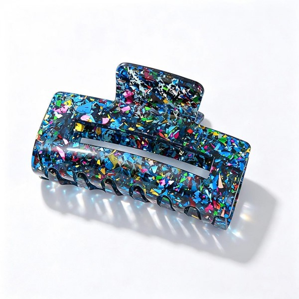 Confetti Glitter Claw Hair Clip, a sparkly statement clip packed with chunky foil flakes set in a glossy acrylic finish. The large rectangular shape and sturdy spring hinge hold thick or long hair in a quick twist, half up style, or easy updo without slipping. A fun everyday accessory for school, work, and weekend outfits that also makes a great stocking stuffer or party favor. Shimmery, affordable, and impossible to walk past, these clips are an easy impulse add at the register.