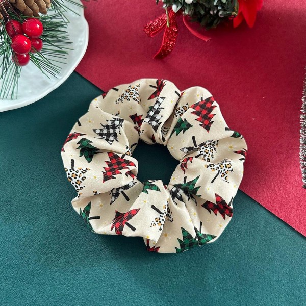 Christmas print scrunchie set that ships as a coordinated multipack, so one pickup covers a full week of holiday outfits. The soft gathered fabric grips a ponytail or a bun without creasing hair or leaving a dent. Festive prints make a simple hair tie feel intentional for classroom parties, family dinners, and photo sessions. Seasonal scrunchie sets are a strong register impulse from November through Christmas.