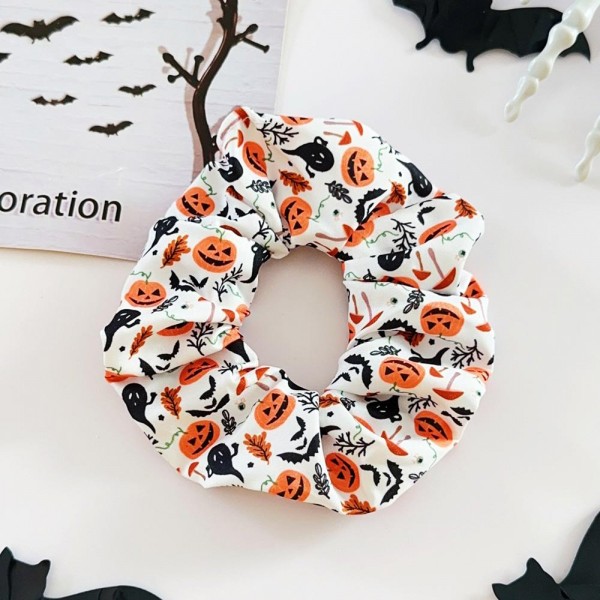 Halloween print scrunchie set that ships as a coordinated multipack, so customers get several looks in one pickup. The soft gathered fabric holds a ponytail or a bun without creasing hair or pulling at the roots. Seasonal prints turn an ordinary hair tie into part of the costume for school parties, trunk or treat nights, and office dress up days. Scrunchie sets are a proven register impulse right through October.