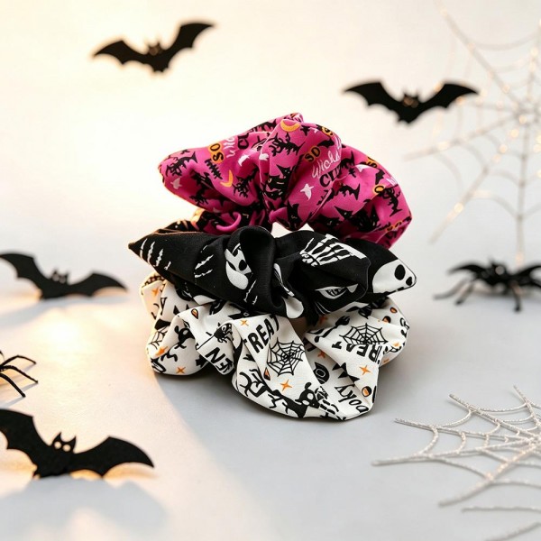 Halloween print scrunchie set that ships as a coordinated multipack, so customers get several looks in one pickup. The soft gathered fabric holds a ponytail or a bun without creasing hair or pulling at the roots. Seasonal prints turn an ordinary hair tie into part of the costume for school parties, trunk or treat nights, and office dress up days. Scrunchie sets are a proven register impulse right through October.