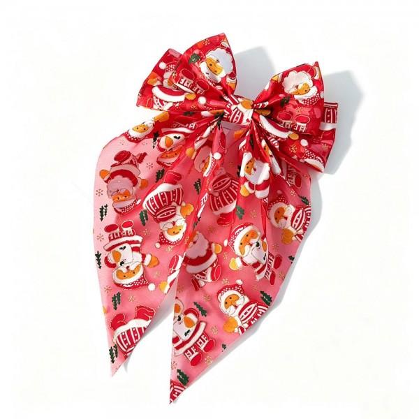 Holiday print bow hair clip with long trailing tails and a snap base that holds securely in fine or thick hair. The seasonal print gives an instant festive touch to a ponytail or a half up style with no effort at all. Lightweight enough to wear through a full day of parties, dinners, and photos. Holiday hair bows are a reliable impulse buy from the first display change through Christmas week.