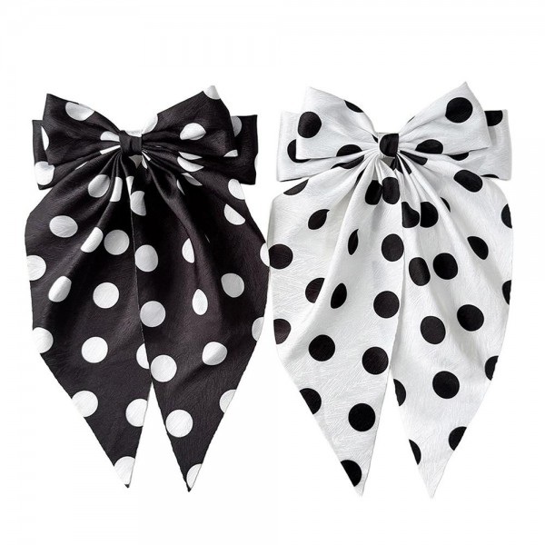 Long tail bow hair clip with a polka dot print and a secure snap base that grips fine and thick hair alike. The flowing tails add movement to a low ponytail, a half up style, or a simple braid. A lightweight satin finish keeps it comfortable enough to forget about during a long day. Bow clips like this are an easy impulse pickup and they merchandise well on a peg display.